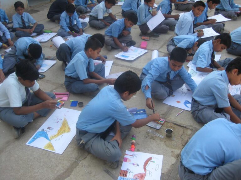 Students painting for painting competition at Silver jubilee of Shahbaaz school and Pu college