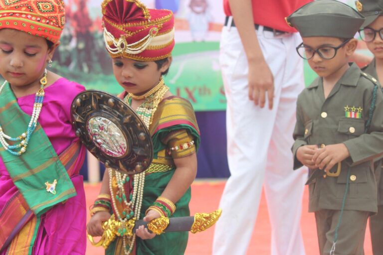 Children performing in fancy dress competition at Independence day celebration at Shahbaaz school and PU college