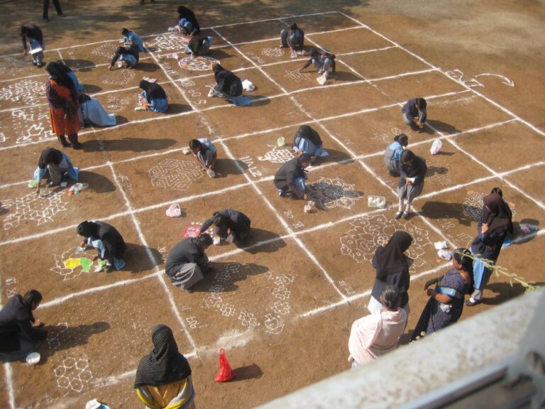 Students of Shahbaaz school and PU college making rangoli