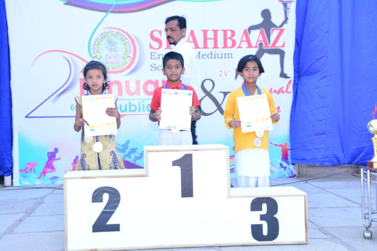 children showing their medal and certificate on republic day at Shahbaaz school and PU college Gulbarga