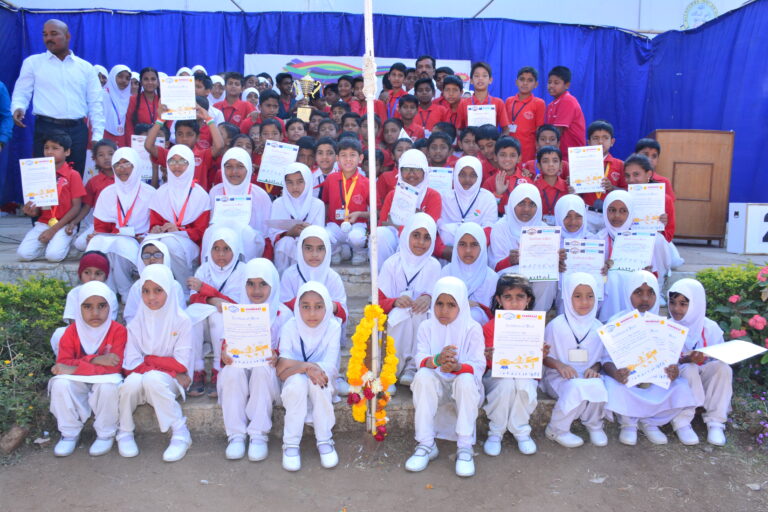 A class of primary school showing their certificates