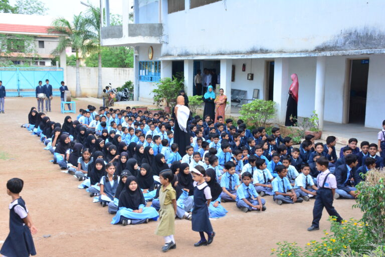 Children sitting in ground of Shahbaaz school and PU college Gulbarga for republic day