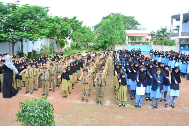 Children pledging at Investiture ceremony at Shahbaaz school and PU college Gulbarga