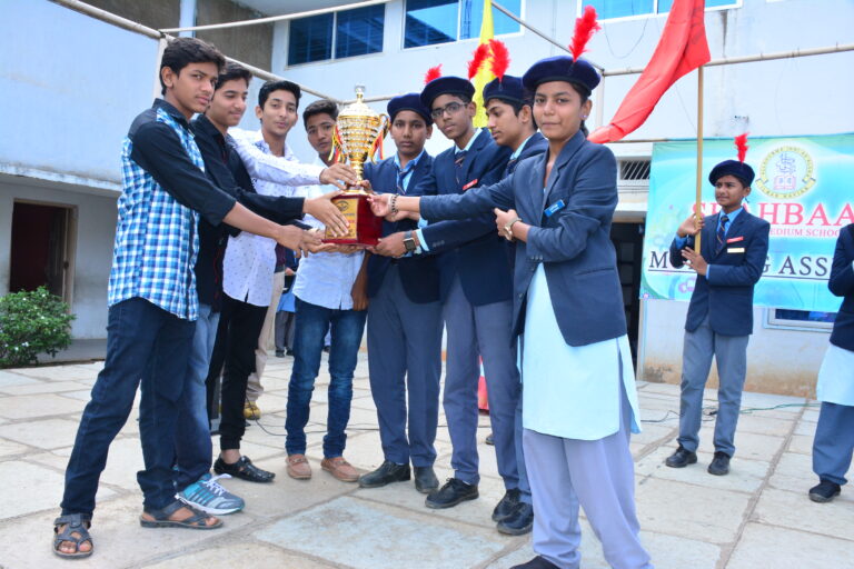 Students holding their trophy at Investiture ceremony at Shahbaaz school and PU college Gulbarga