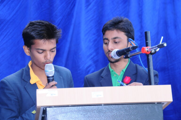 Two boys from Shahbaaz school and PU college giving a speech