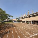 Shahbaaz School Playground With Landscaped Garden, Parking, and Raised Stage